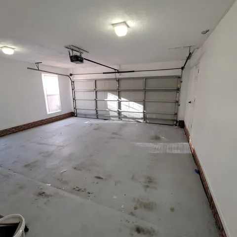 a view of a kitchen with wooden cabinets