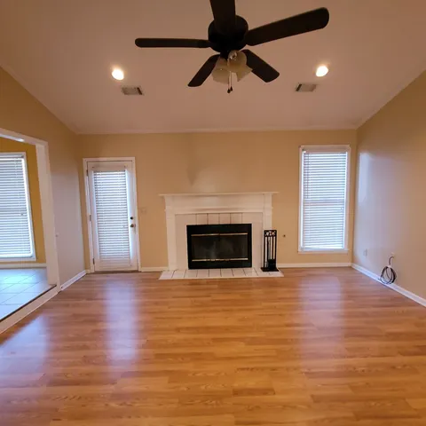a view of hallway with wooden floor