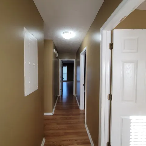 a bed sitting in a bedroom next to a wooden door