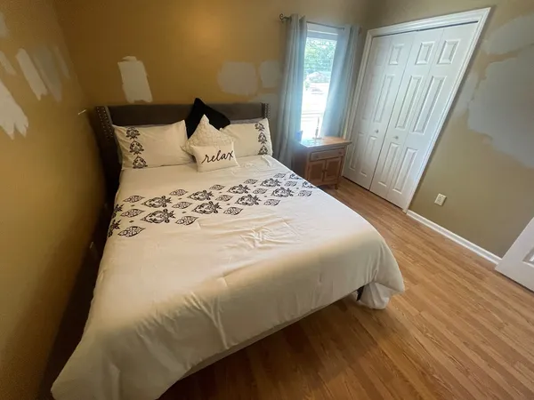 a living room with furniture a ceiling fan and a window