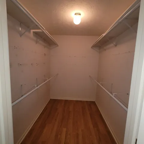 a bathroom with a bathtub sink and mirror