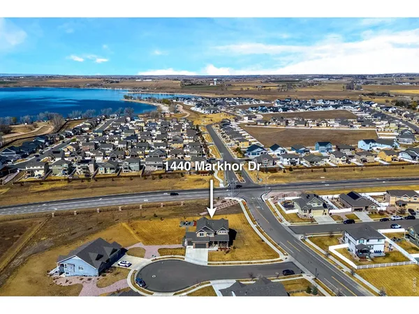 a view of a swimming pool with a table and chairs