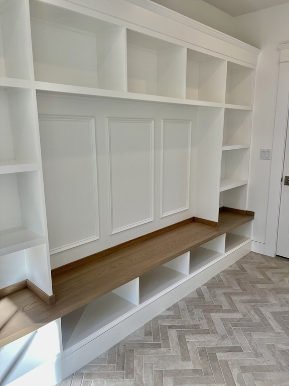 27 Bold Meadow Road Edgartown, MA 02539 - Photo 13 of 40 a view of an empty room with wooden floor and cabinet