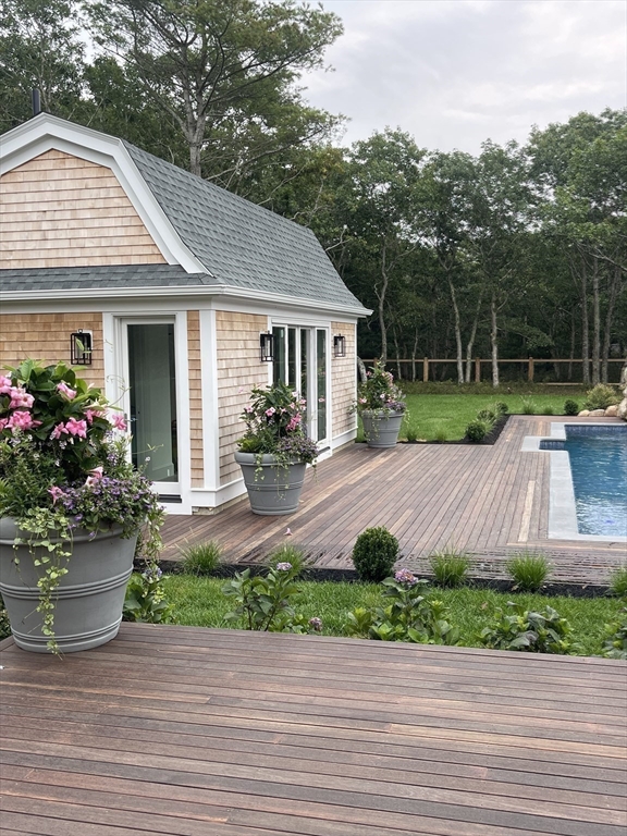 27 Bold Meadow Road Edgartown, MA 02539 - Photo 21 of 40 a view of a house with a yard and plants