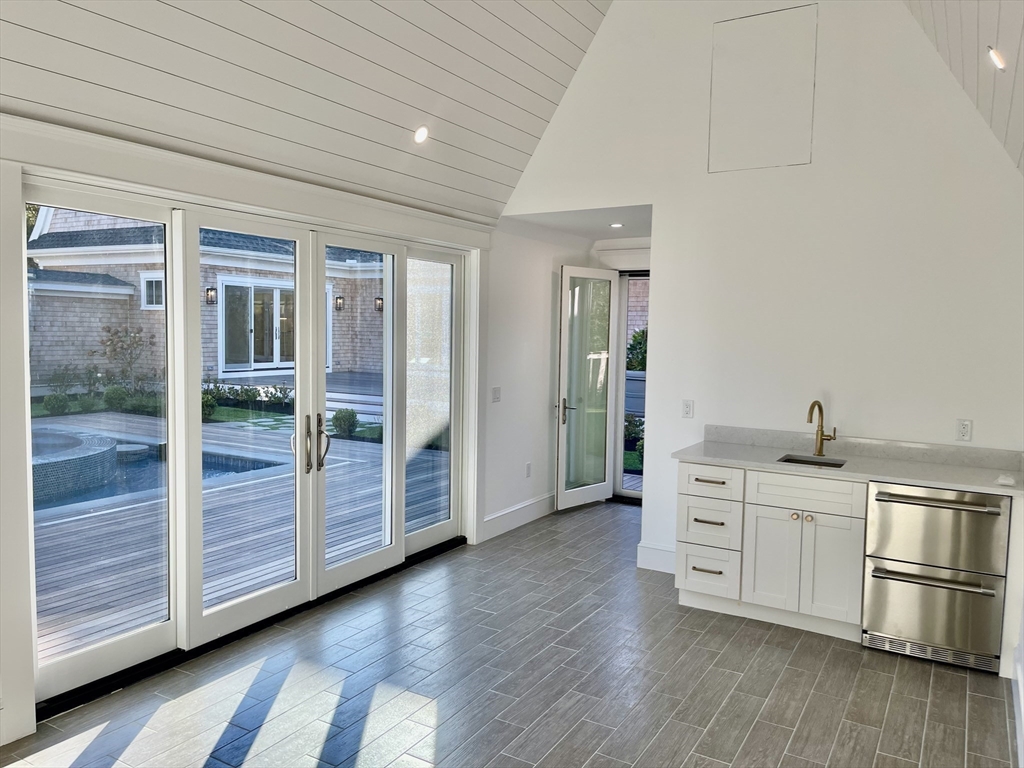27 Bold Meadow Road Edgartown, MA 02539 - Photo 23 of 40 a kitchen with stainless steel appliances granite countertop a stove and a refrigerator