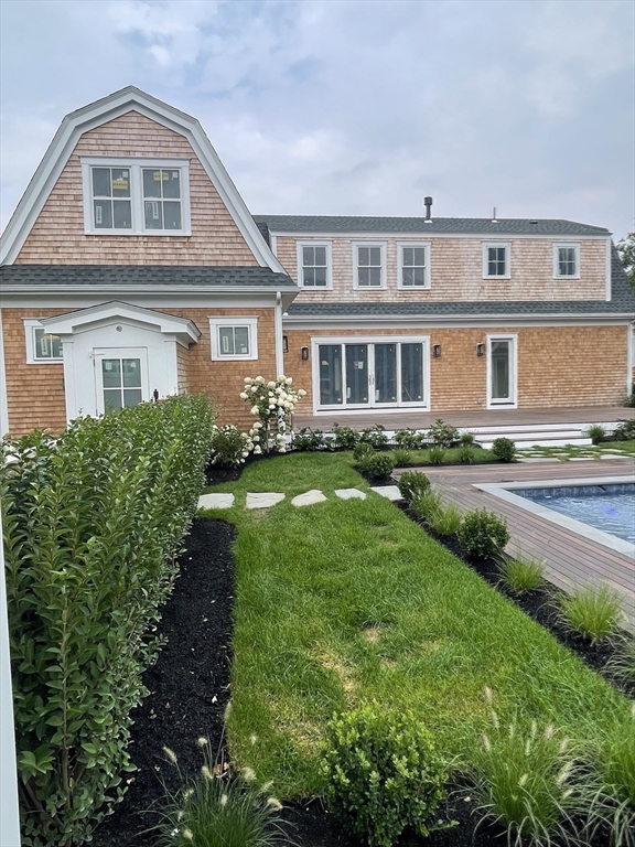 27 Bold Meadow Road Edgartown, MA 02539 - Photo 25 of 40 a front view of a house with a yard