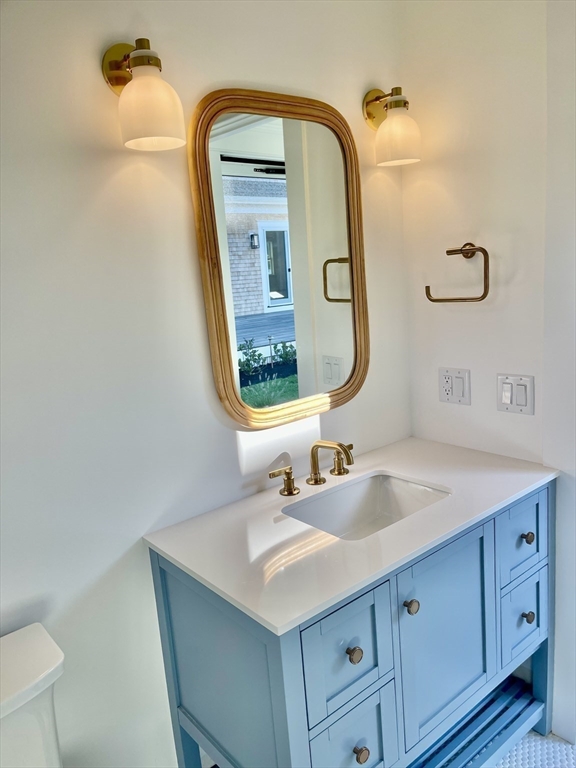27 Bold Meadow Road Edgartown, MA 02539 - Photo 38 of 40 a bathroom with a sink and a mirror