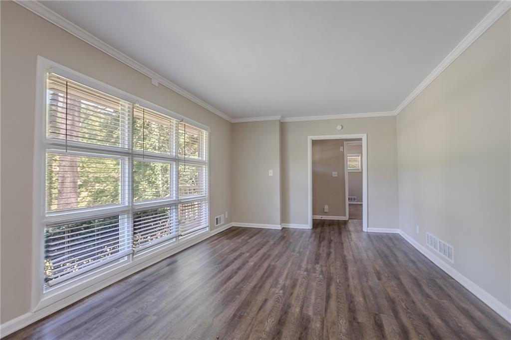 2755 Rockcliff Road Southeast Atlanta, GA 30316 - Photo 11 of 37 wooden floor in an empty room with a window