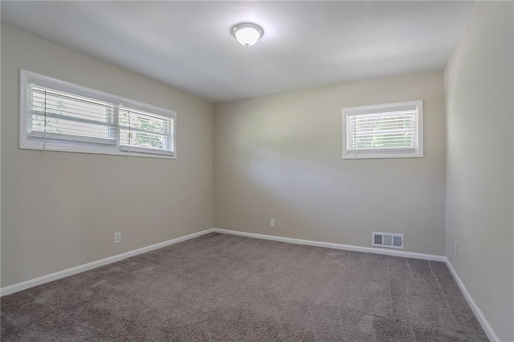 2755 Rockcliff Road Southeast Atlanta, GA 30316 - Photo 12 of 37 an empty room with a window
