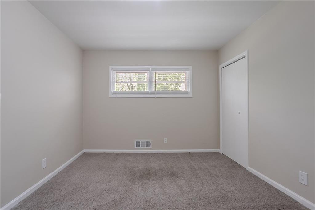 2755 Rockcliff Road Southeast Atlanta, GA 30316 - Photo 14 of 37 an empty room with a window
