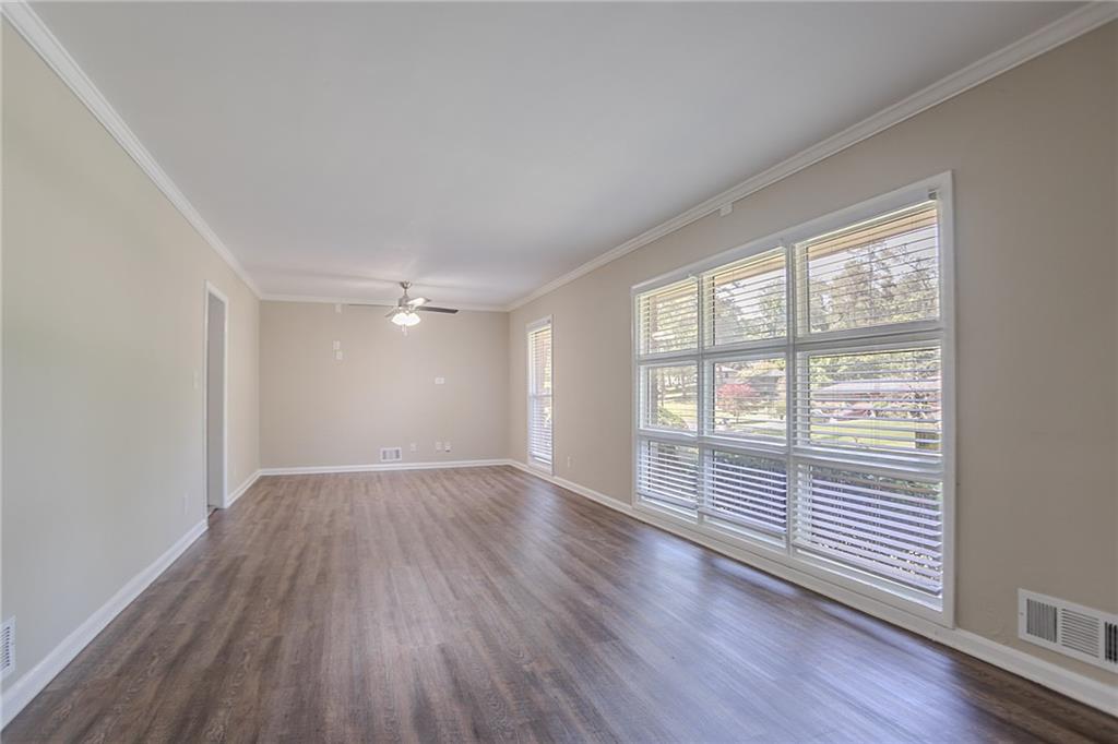 2755 Rockcliff Road Southeast Atlanta, GA 30316 - Photo 8 of 37 an empty room with wooden floor and windows