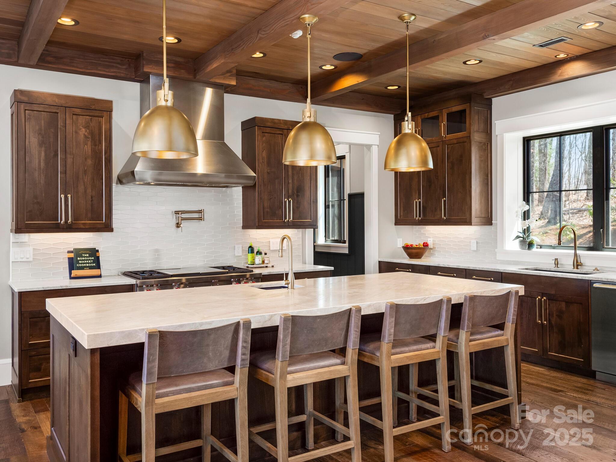 61 Back Bone Way, Unit 203 Sylva, NC 28779 - Photo 14 of 48 a kitchen with a table and chairs in it