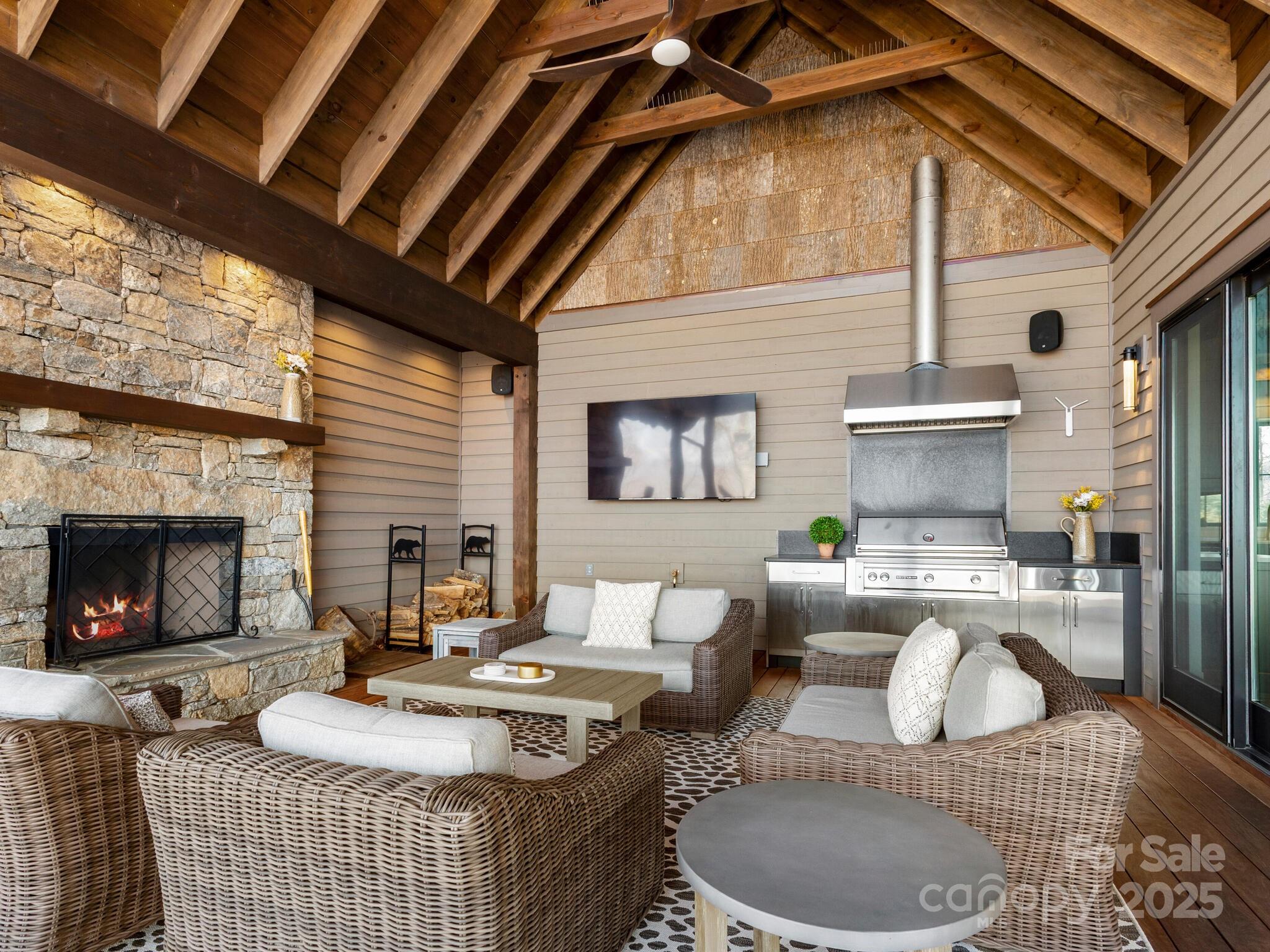 61 Back Bone Way, Unit 203 Sylva, NC 28779 - Photo 18 of 48 a living room with furniture and a fireplace