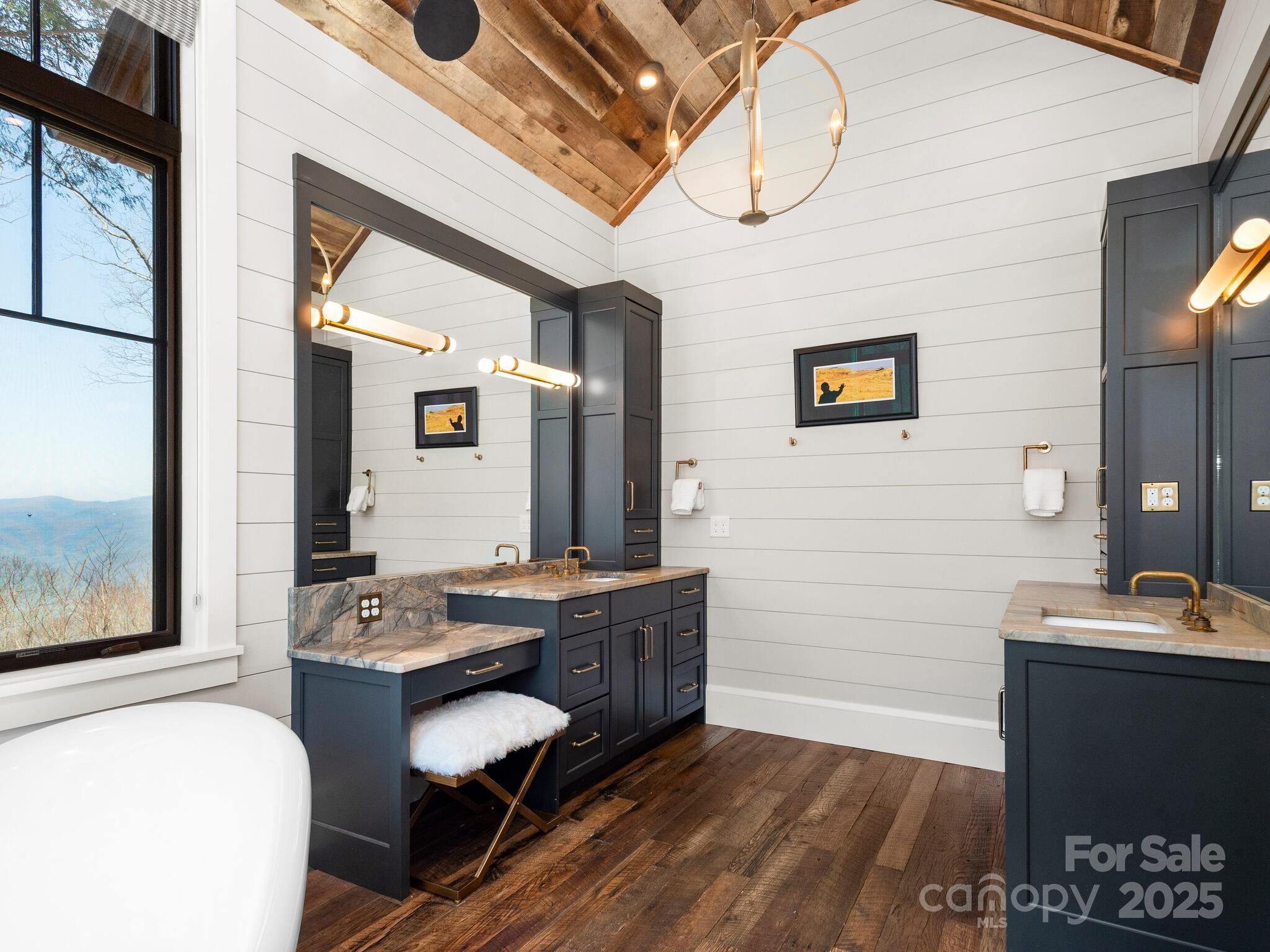61 Back Bone Way, Unit 203 Sylva, NC 28779 - Photo 23 of 48 a bathroom with a sink a vanity and a mirror