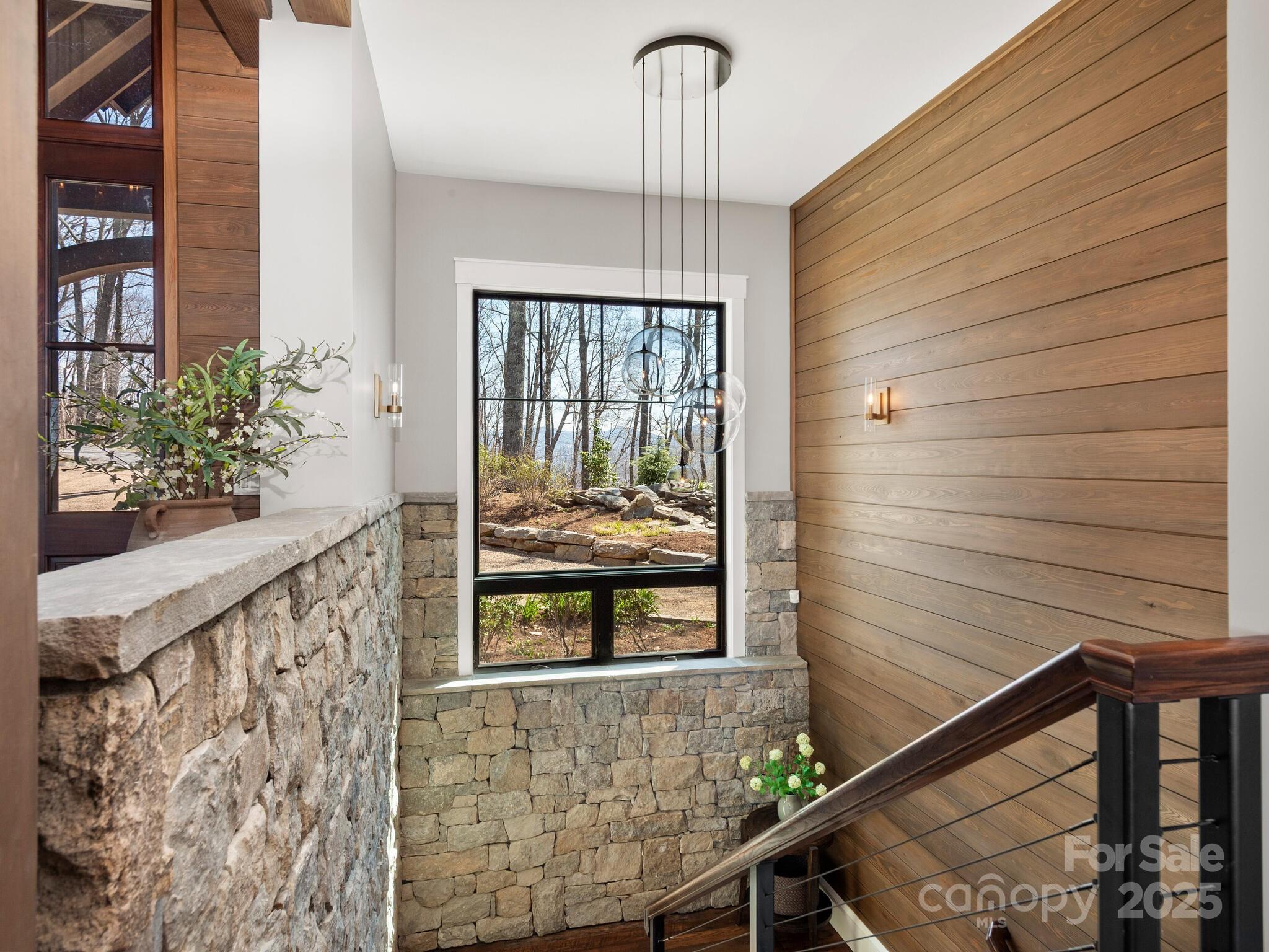 61 Back Bone Way, Unit 203 Sylva, NC 28779 - Photo 29 of 48 a view of a balcony with furniture