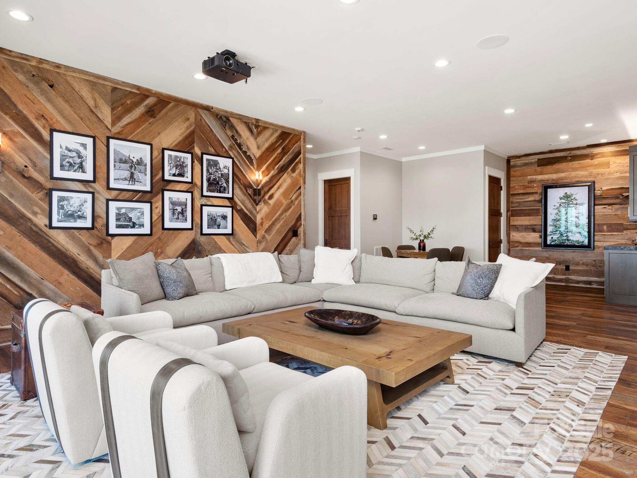 61 Back Bone Way, Unit 203 Sylva, NC 28779 - Photo 32 of 48 a living room with furniture a rug and a window