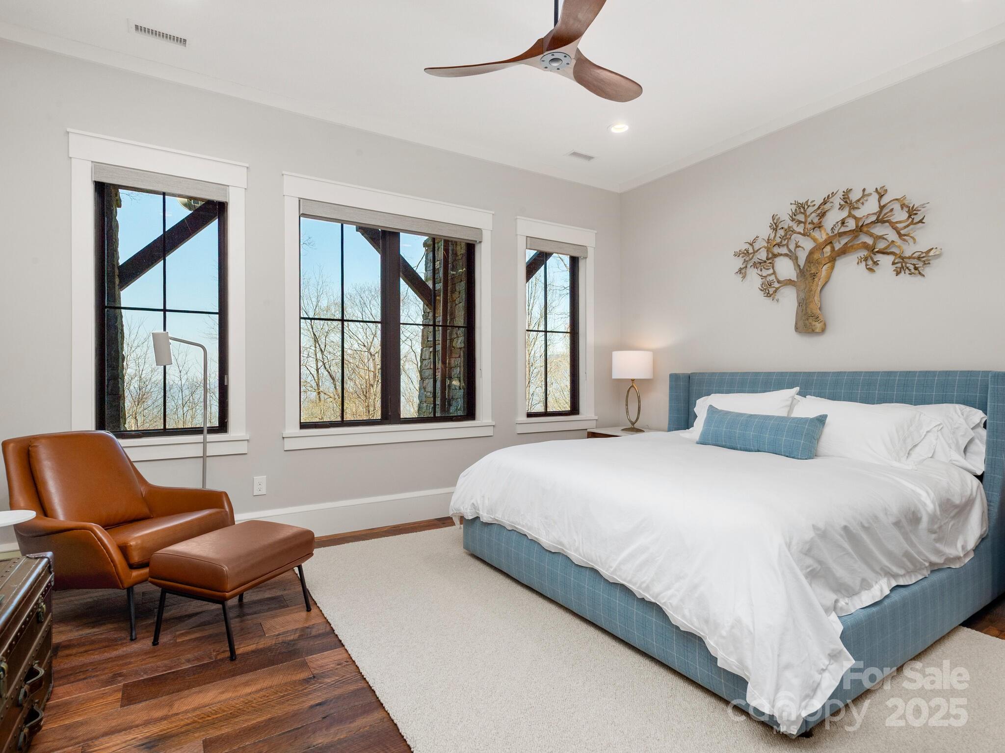 61 Back Bone Way, Unit 203 Sylva, NC 28779 - Photo 35 of 48 a bedroom with a bed and chair