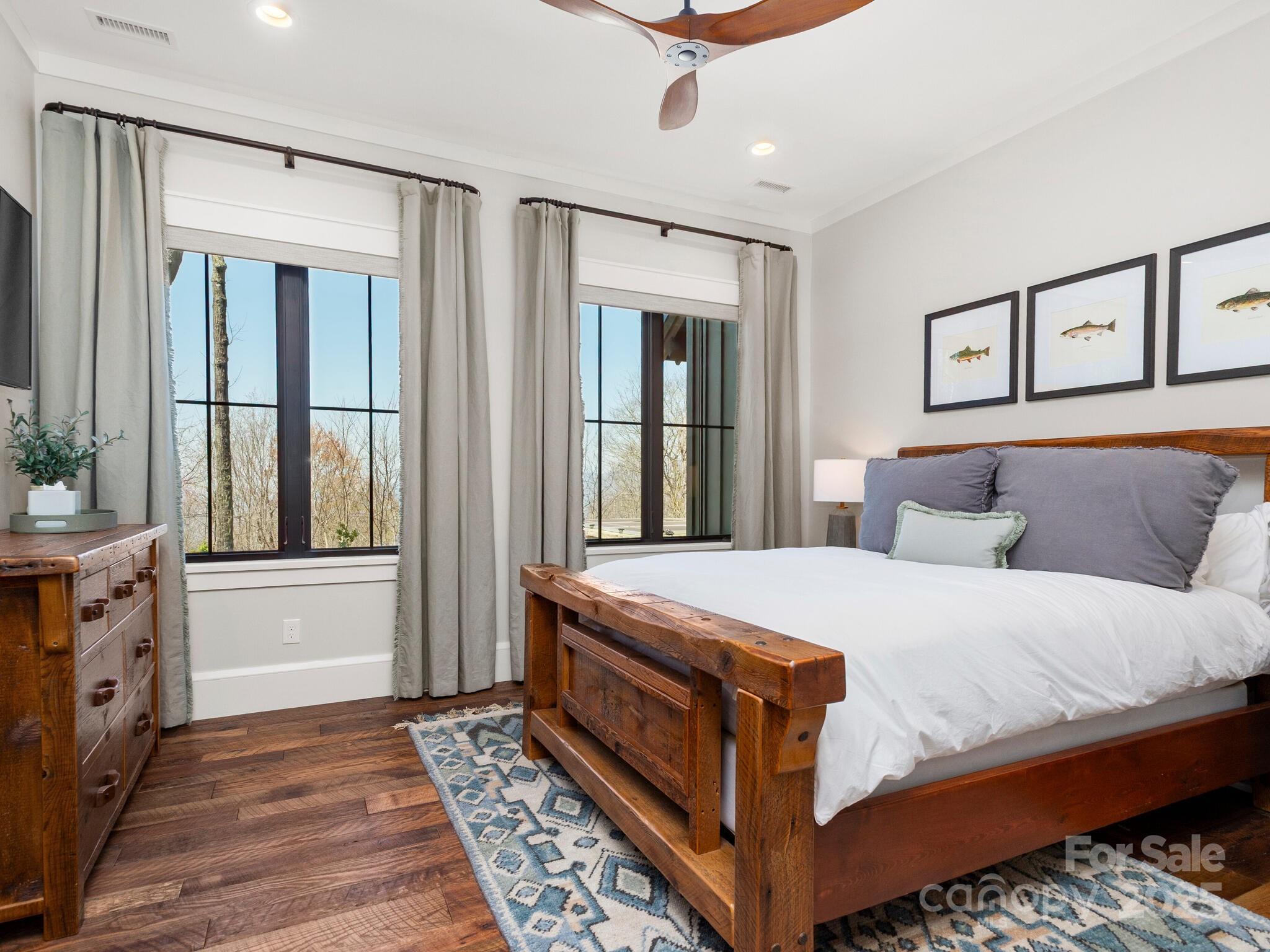 61 Back Bone Way, Unit 203 Sylva, NC 28779 - Photo 38 of 48 a bedroom with a large bed and a window