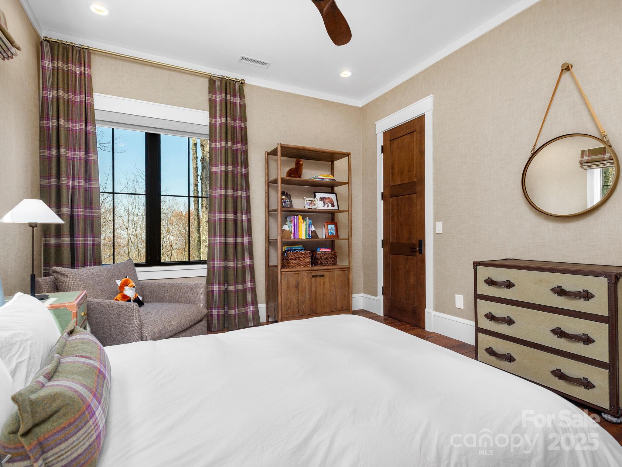 61 Back Bone Way, Unit 203 Sylva, NC 28779 - Photo 41 of 48 a bedroom with a bed and a flat tv screen