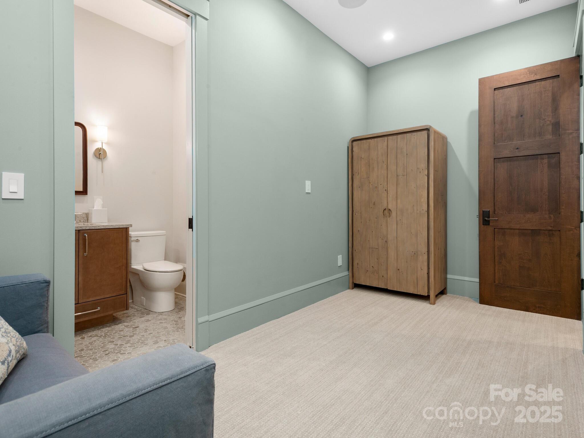 61 Back Bone Way, Unit 203 Sylva, NC 28779 - Photo 44 of 48 a view of a bathroom with toilet and shower
