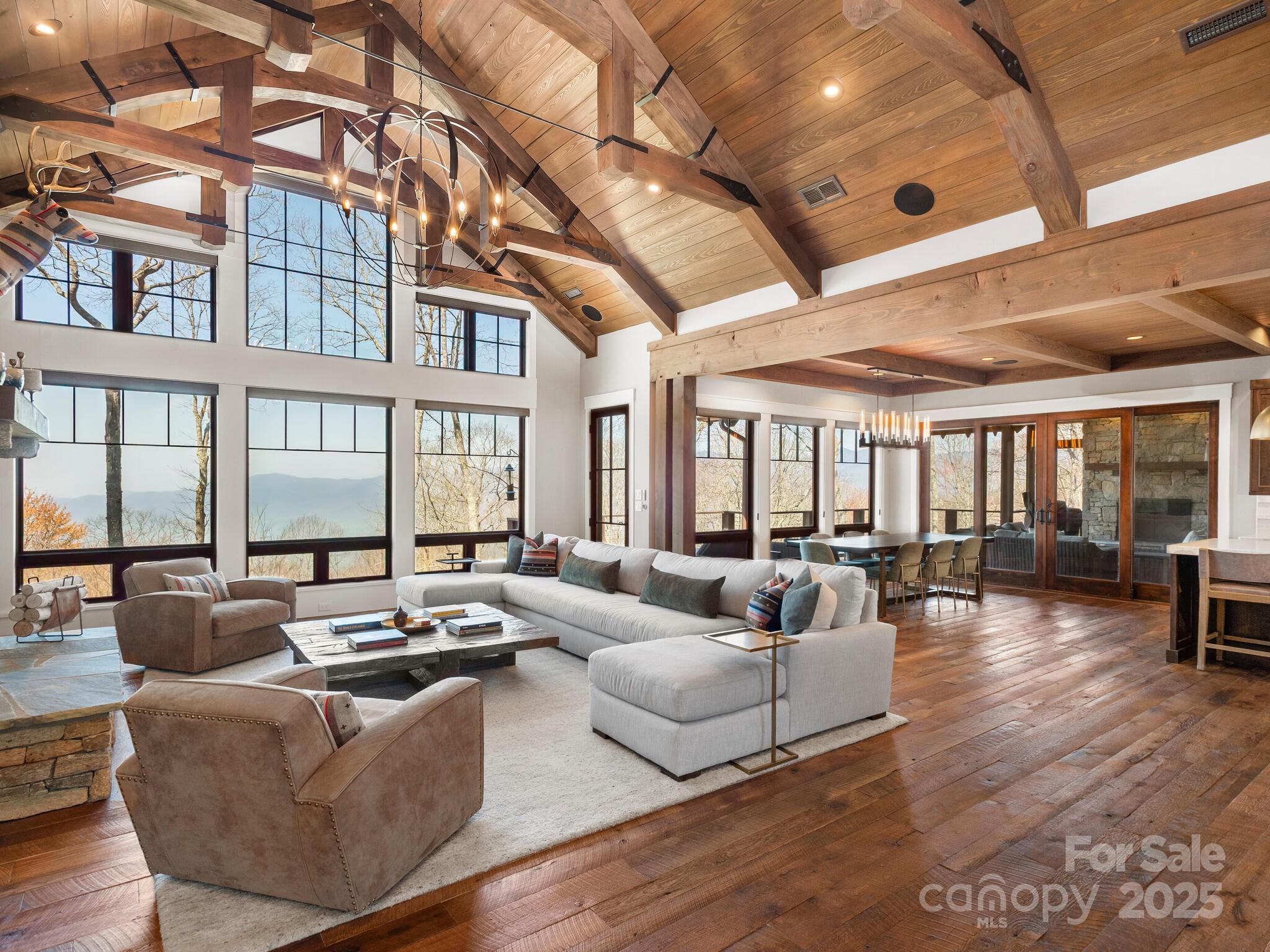 61 Back Bone Way, Unit 203 Sylva, NC 28779 - Photo 5 of 48 a living room with furniture and wooden floor