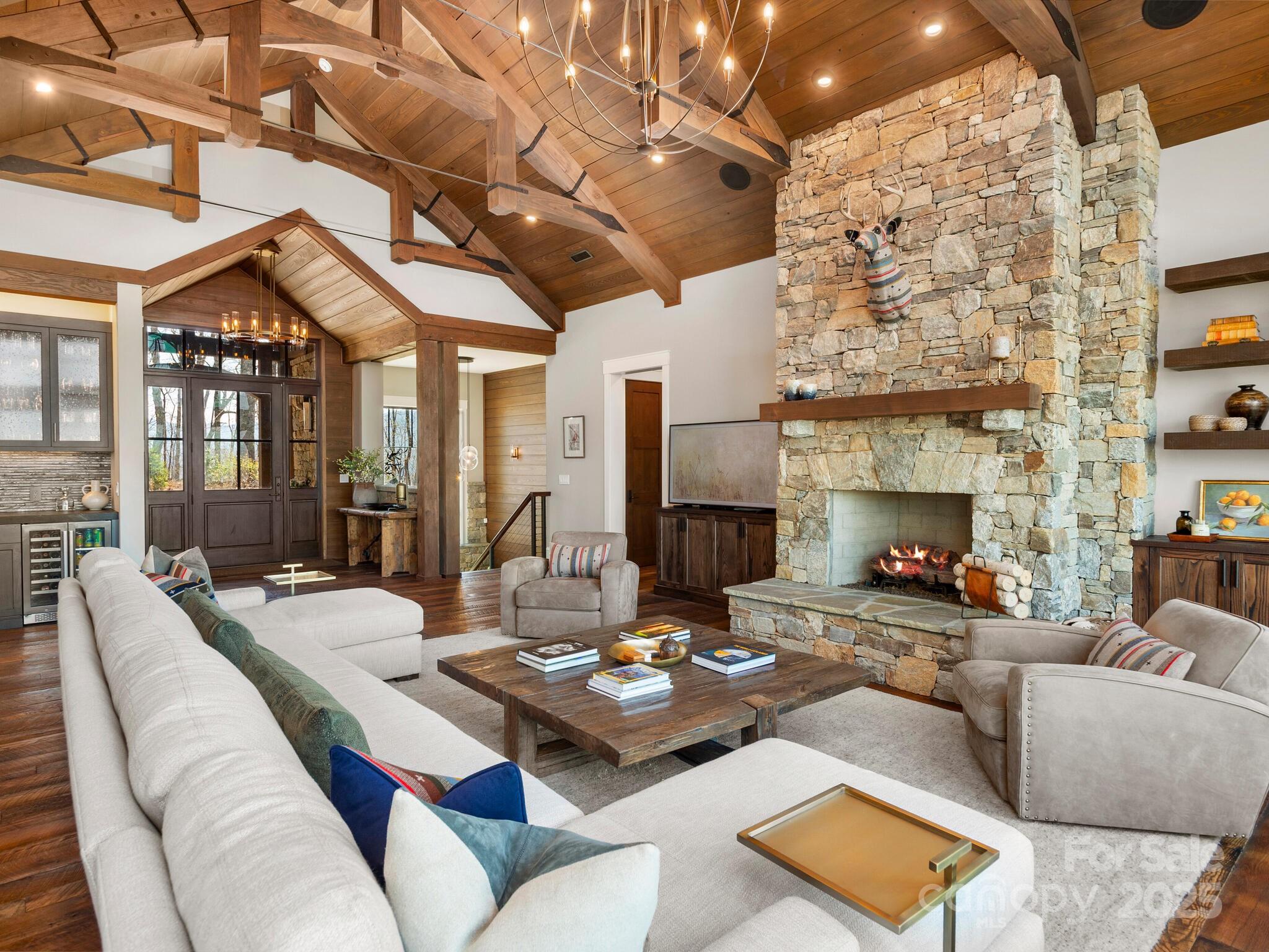 61 Back Bone Way, Unit 203 Sylva, NC 28779 - Photo 8 of 48 a living room with furniture and a fireplace