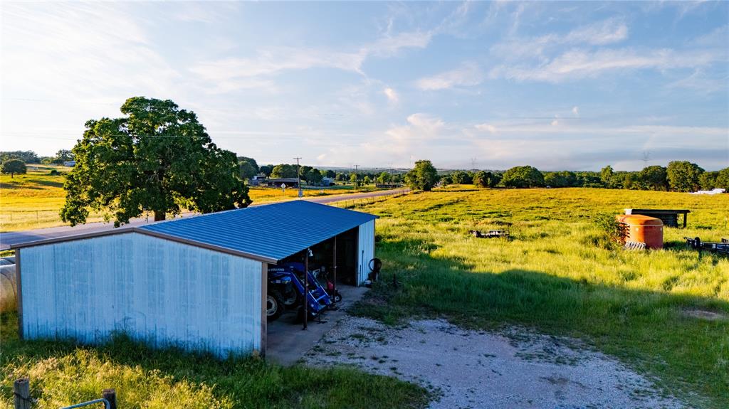 18100 Farm To Market 920 Poolville, TX 76487 - Photo 6 of 32 a view of a house with a ocean view
