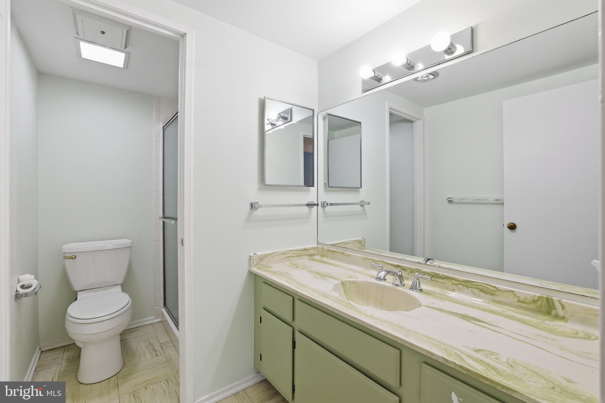 6101 Edsall Road, Unit 502 Alexandria, VA 22304 - Photo 24 of 33 Hallway bathroom with wide vanity and shower