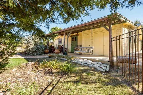 a bed room with a bed and a chair