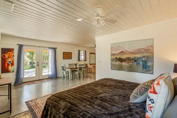 a living room with fireplace furniture and a rug