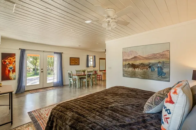 a living room with fireplace furniture and a rug