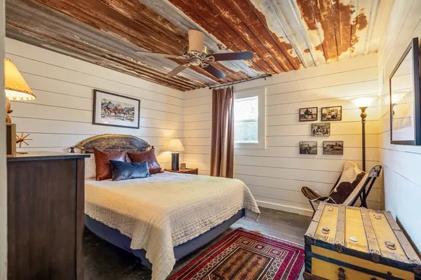 a living room with furniture and a rug