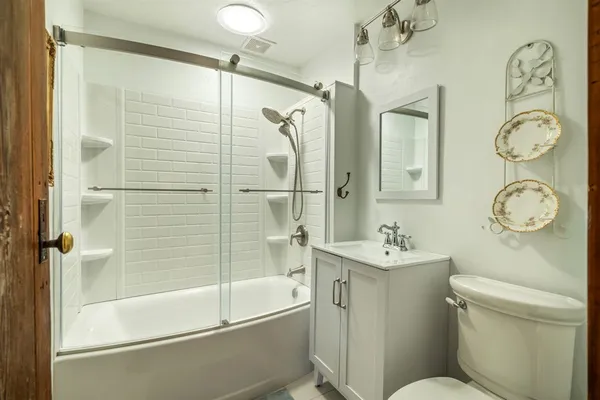 a bed room with a bed and a chandelier