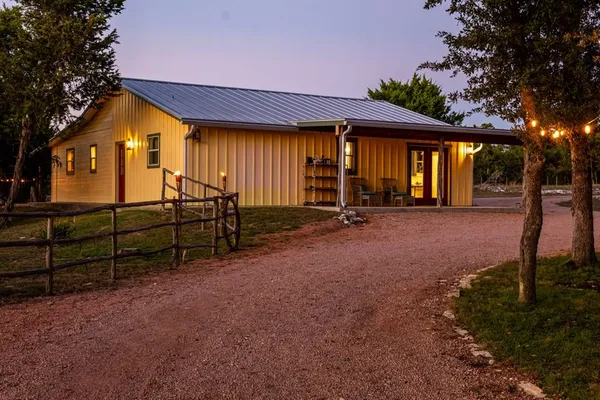 a view of a street with large trees