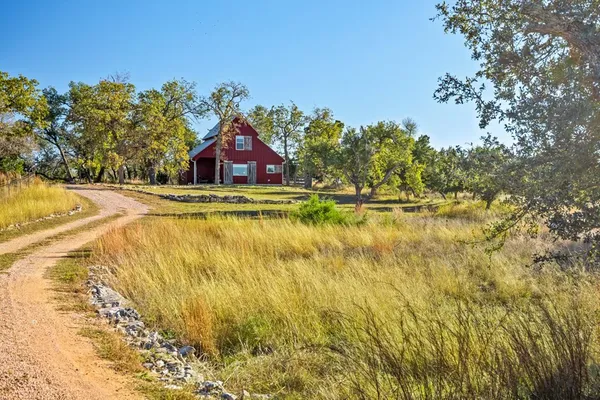 a bedroom with a bed closet and flat tv screen
