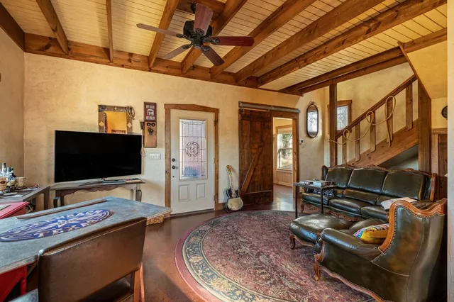 a kitchen with granite countertop a refrigerator and a sink