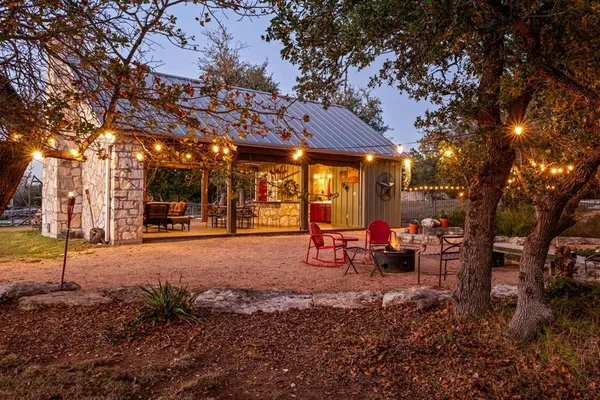 a view of a porch with furniture and next to a yard