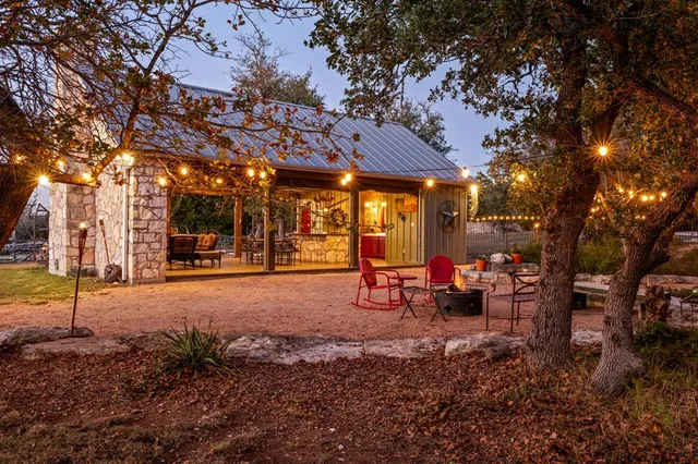 a view of a porch with furniture and next to a yard
