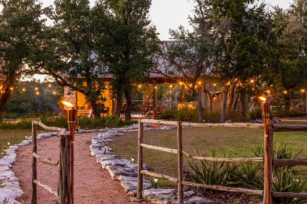 a bedroom with a bed rug and window
