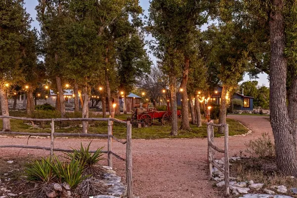 a bedroom with furniture and a large window