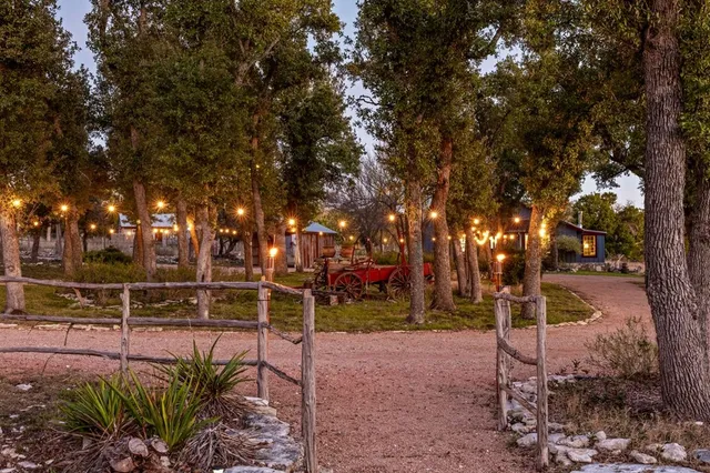 a bedroom with furniture and a large window