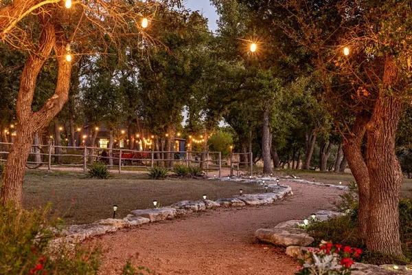 a living room with furniture a bed and a table