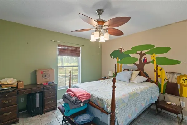 a bedroom with a bed and dresser