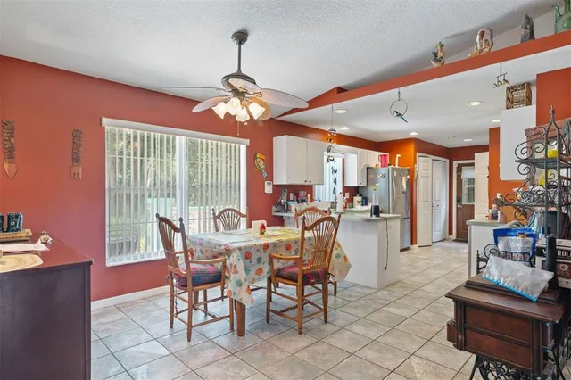 a view of a dining room with furniture window and outside view