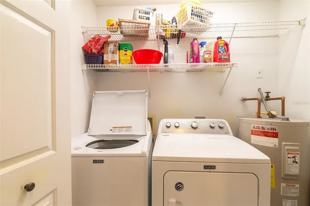 a utility room with dryer and washer
