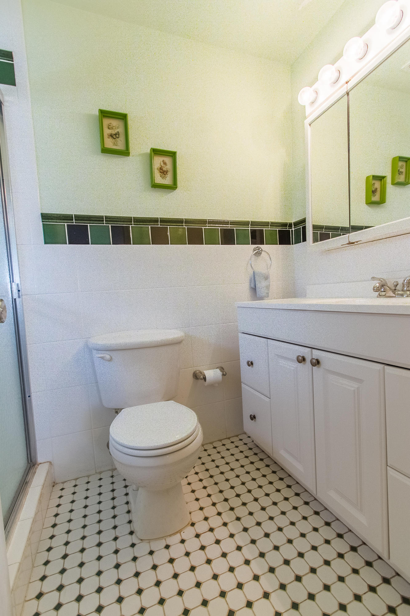22366 Southwest 65th Avenue Boca Raton, FL 33428 - Photo 19 of 22 a bathroom with a sink a toilet and a mirror