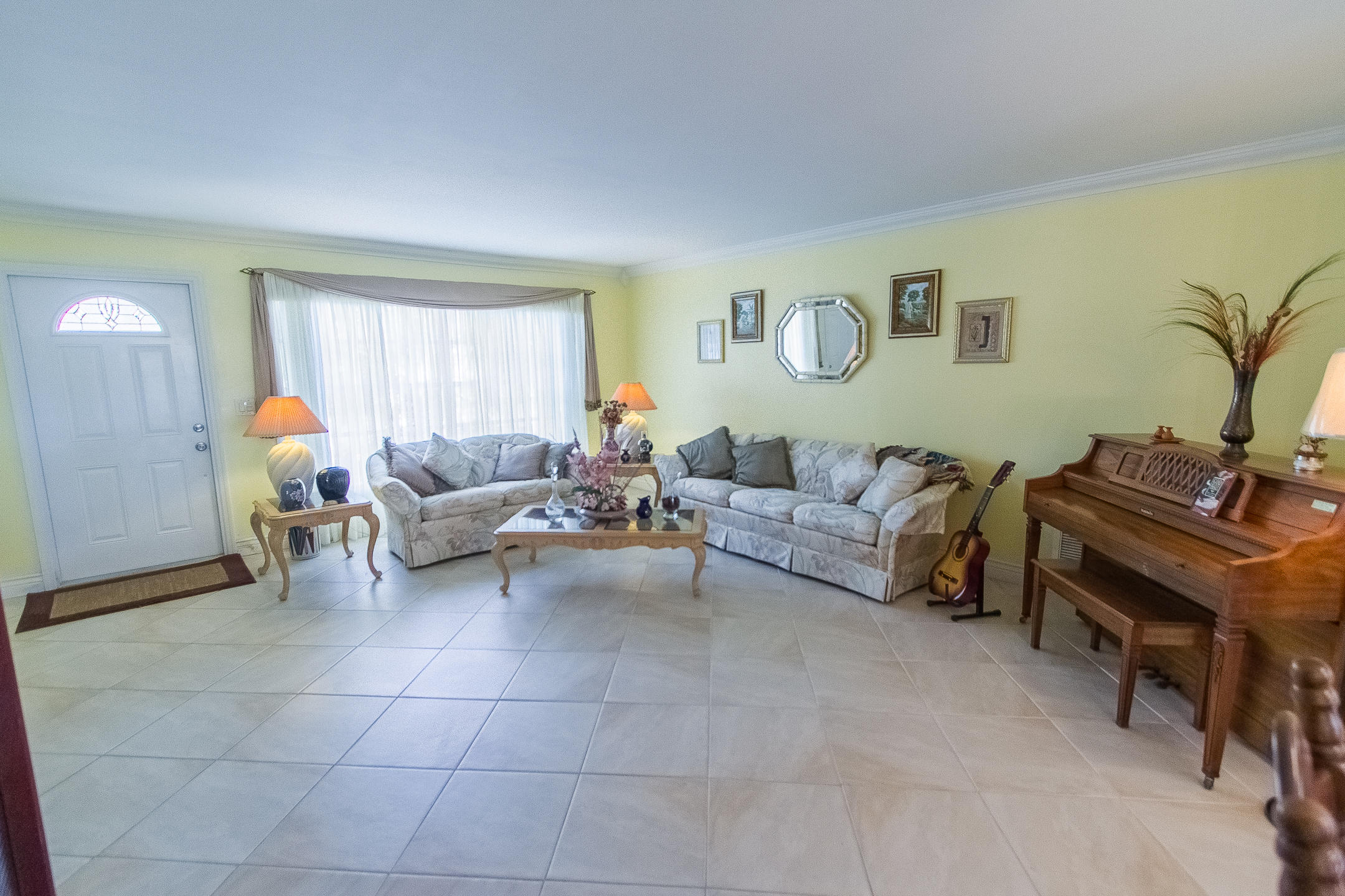 22366 Southwest 65th Avenue Boca Raton, FL 33428 - Photo 7 of 22 a living room with furniture and a window