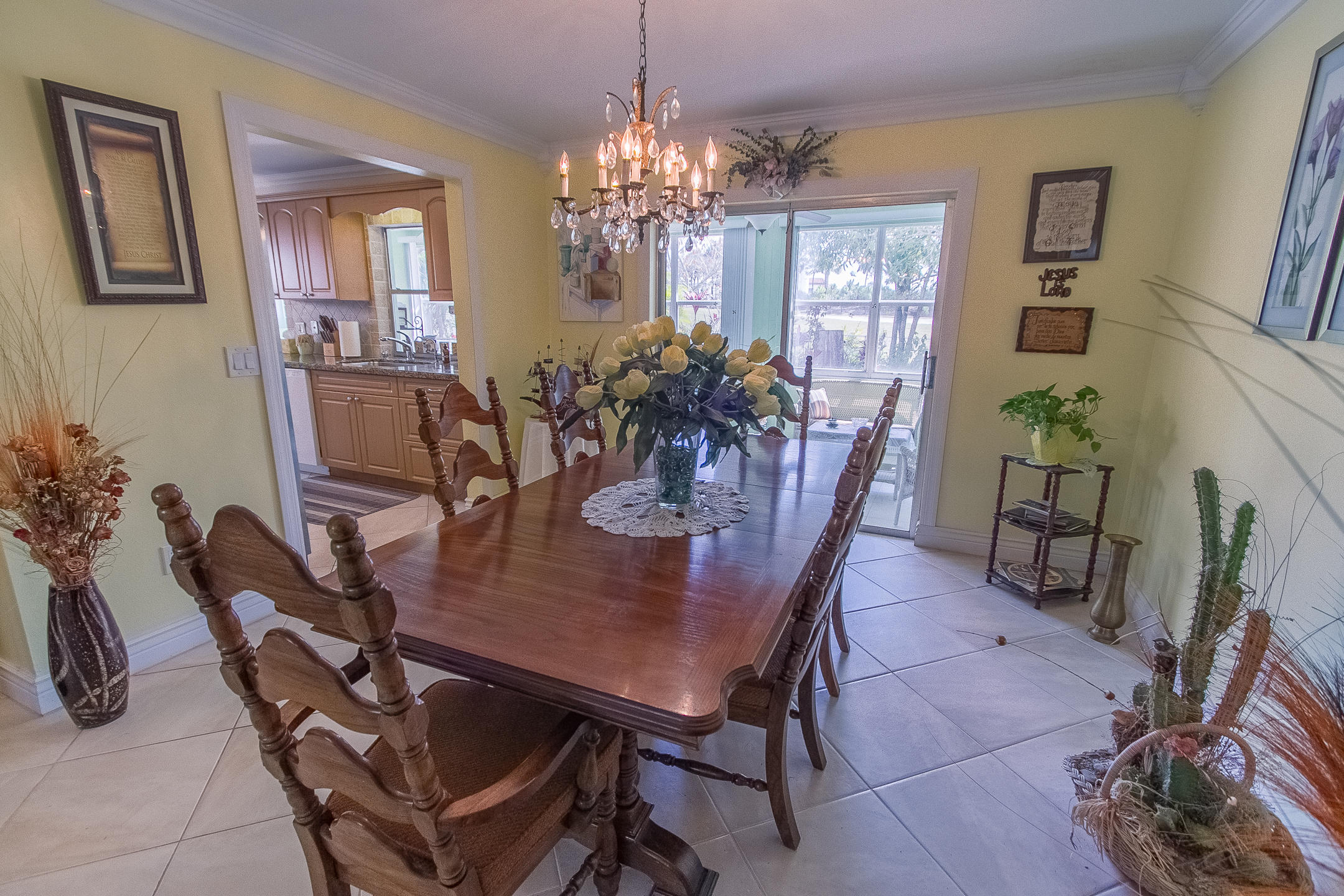 22366 Southwest 65th Avenue Boca Raton, FL 33428 - Photo 8 of 22 a view of a dining room with furniture and chandelier