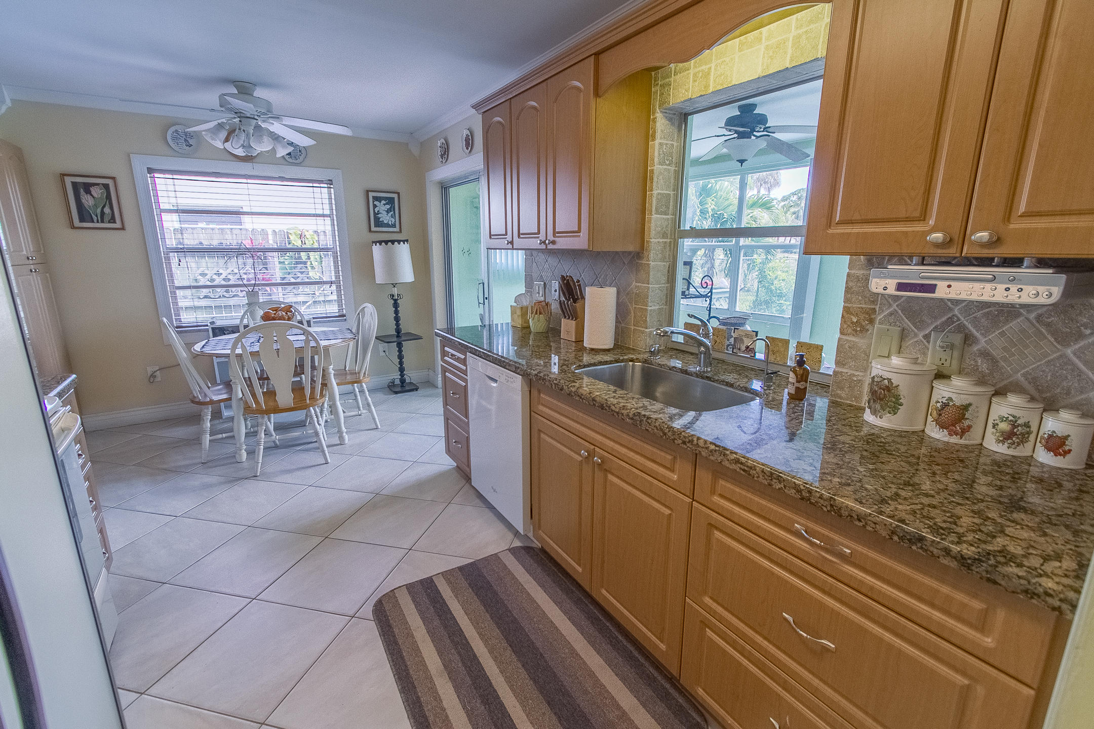 22366 Southwest 65th Avenue Boca Raton, FL 33428 - Photo 10 of 22 a kitchen with a sink and cabinets