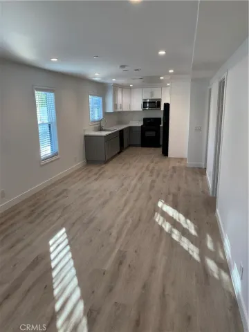 a view of kitchen and kitchen with furniture large window
